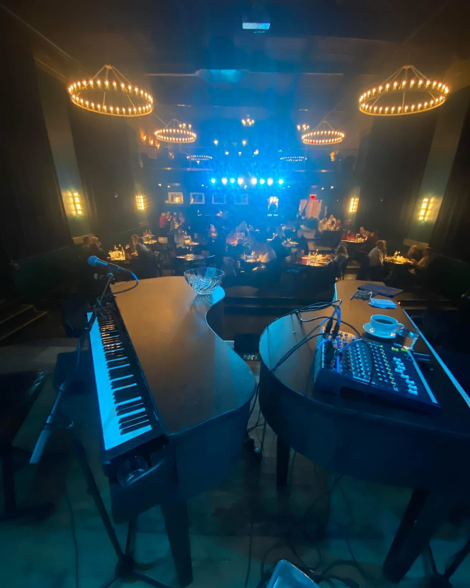 Dueling pianos set up on a live entertainment stage